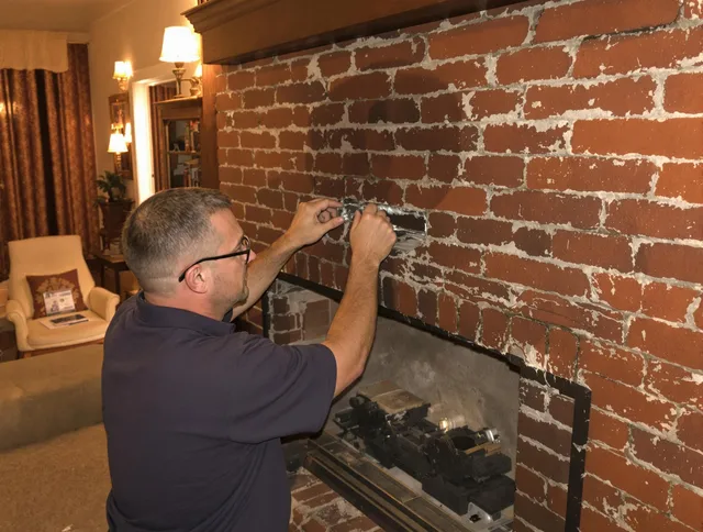 Colton Chimney Sweep expert fixing a fireplace in Colton, CA